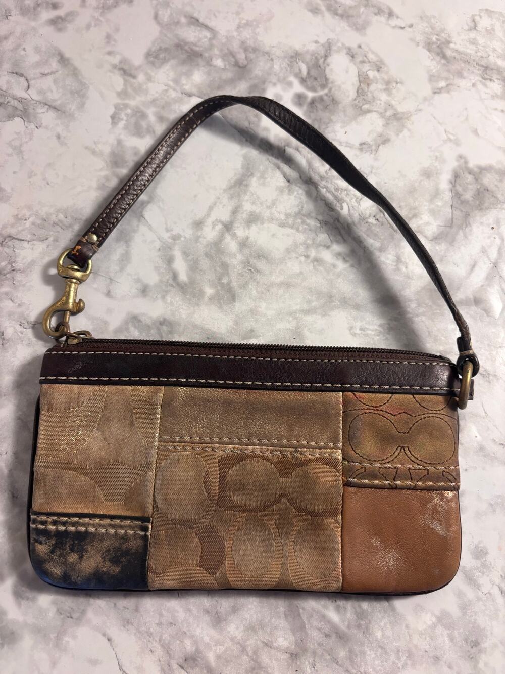 Brown and gold Coach wristlets